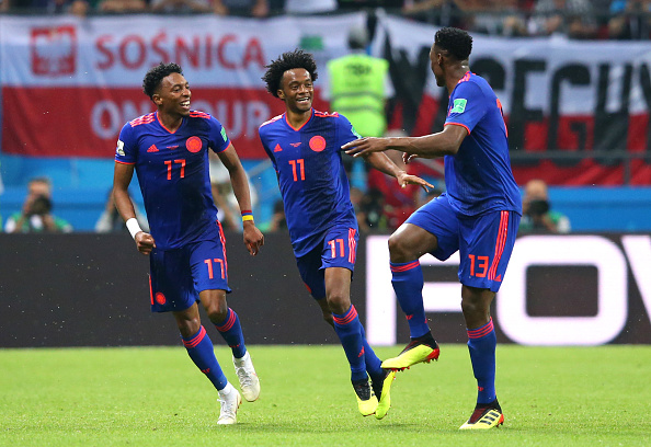 KAZAN, RUSSIA - JUNE 24:  Juan Cuadrado of Colombia celebrates after scoring his team's third goal with his Colombia team mates during the 2018 FIFA World Cup Russia group H match between Poland and Colombia at Kazan Arena on June 24, 2018 in Kazan, Russia.  (Photo by Alex Livesey/Getty Images)