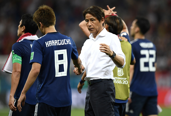 ROSTOV-ON-DON, RUSSIA - JULY 02:  Akira Nishino, Manager of Japan speaks with Genki Haraguchi of Japan following their sides defeat in the 2018 FIFA World Cup Russia Round of 16 match between Belgium and Japan at Rostov Arena on July 2, 2018 in Rostov-on-Don, Russia.  (Photo by Carl Court/Getty Images)