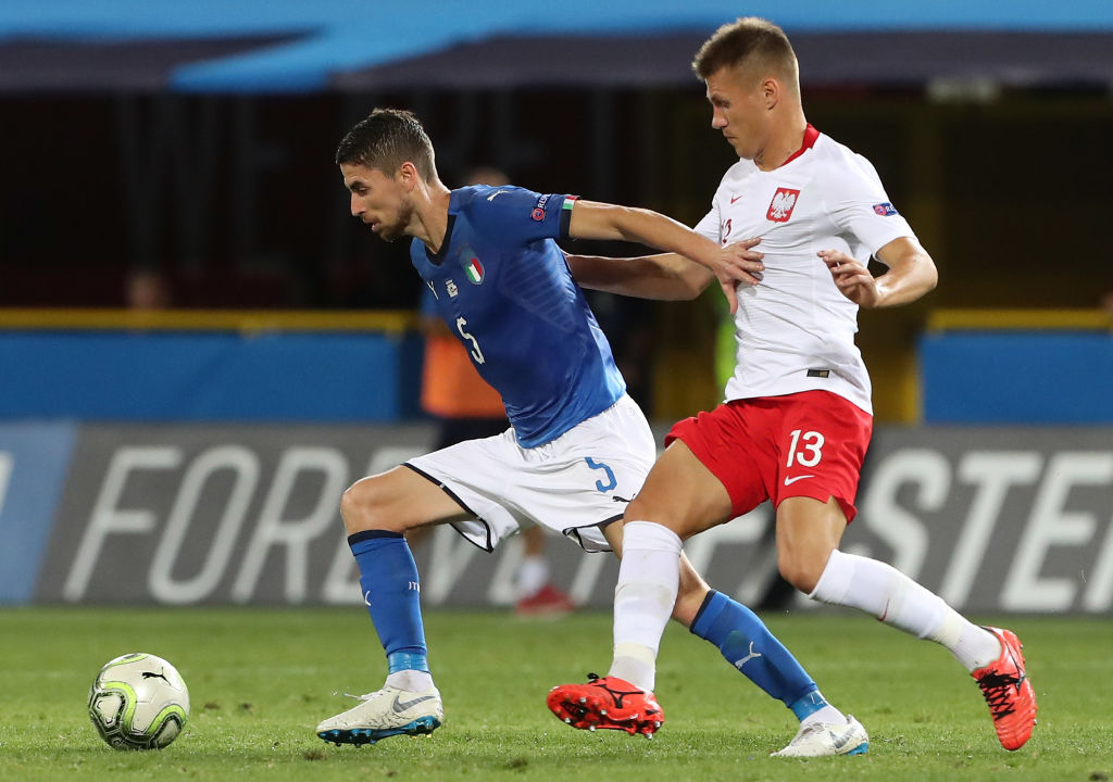 BOLOGNA, ITALY - SEPTEMBER 07:  Jorginho of Italy compets for the ball against Damian Szymanski of Poland during the UEFA Nations League A group three match between Italy and Poland at Stadio Renato Dall'Ara on September 7, 2018 in Bologna, Italy.  (Photo by Marco Luzzani/Getty Images)