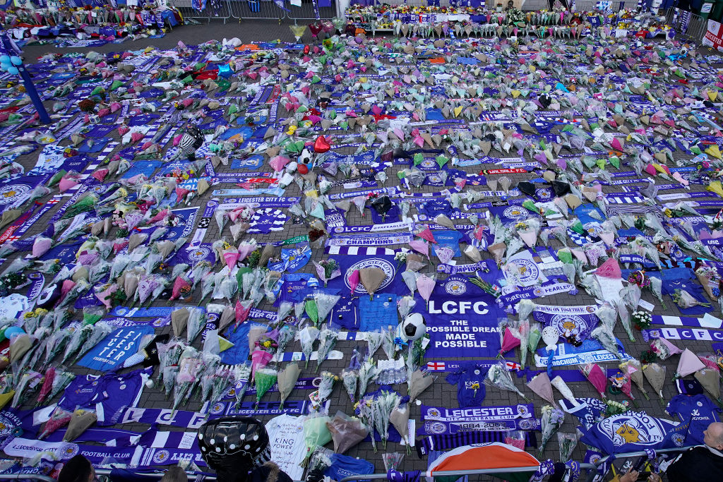 LEICESTER, ENGLAND - OCTOBER 29: A sea of tributes adorns Leicester City's King Power Stadium after owner Vichai Srivaddhanaprabha and four others died in a helicopter crash at the club's stadium, on October 28, 2018 in Leicester, England. The owner of Leicester City Football Club, Vichai Srivaddhanaprabha, was among the five people who died in the helicopter crash on Saturday evening after the club's game against West Ham. (Photo by Christopher Furlong/Getty Images)