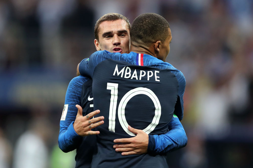 MOSCOW, RUSSIA - JULY 15:  Antoine Griezmann of France celebrates with Kylian Mbappe after Paul Pogba (not pictured) scores his teams third goal as Danijel Subasic of Croatia lies deejcted during the 2018 FIFA World Cup Final between France and Croatia at Luzhniki Stadium on July 15, 2018 in Moscow, Russia.  (Photo by Clive Rose/Getty Images)