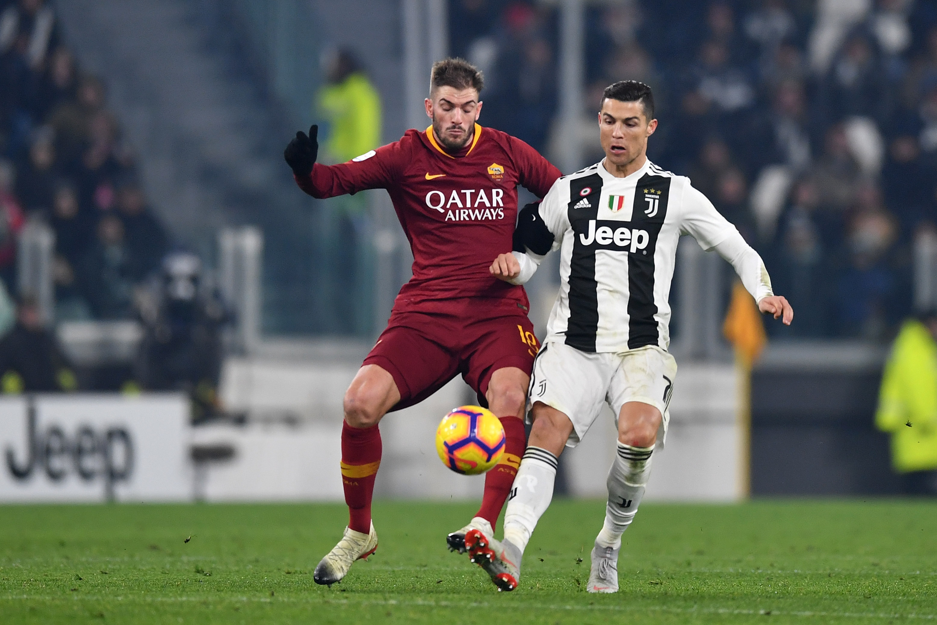 TURIN, ITALY - DECEMBER 22: Cristiano Ronaldo of Juventus competes for the ball with Davide Santon of AS Roma during the Serie A match between Juventus and AS Roma on December 22, 2018 in Turin, Italy.  (Photo by Valerio Pennicino - Juventus FC/Juventus FC via Getty Images)