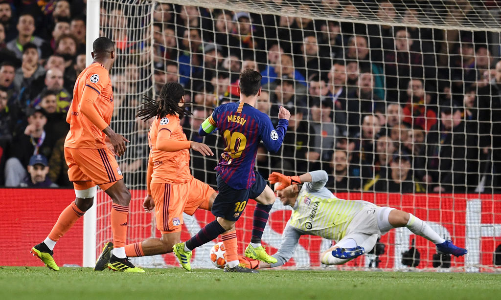 BARCELONA, SPAIN - MARCH 13:  Lionel Messi of Barcelona (10) scores his team's third goal past Mathieu Gorgelin of Olympique Lyonnais during the UEFA Champions League Round of 16 Second Leg match between FC Barcelona and Olympique Lyonnais at Nou Camp on March 13, 2019 in Barcelona, Spain. (Photo by David Ramos/Getty Images)