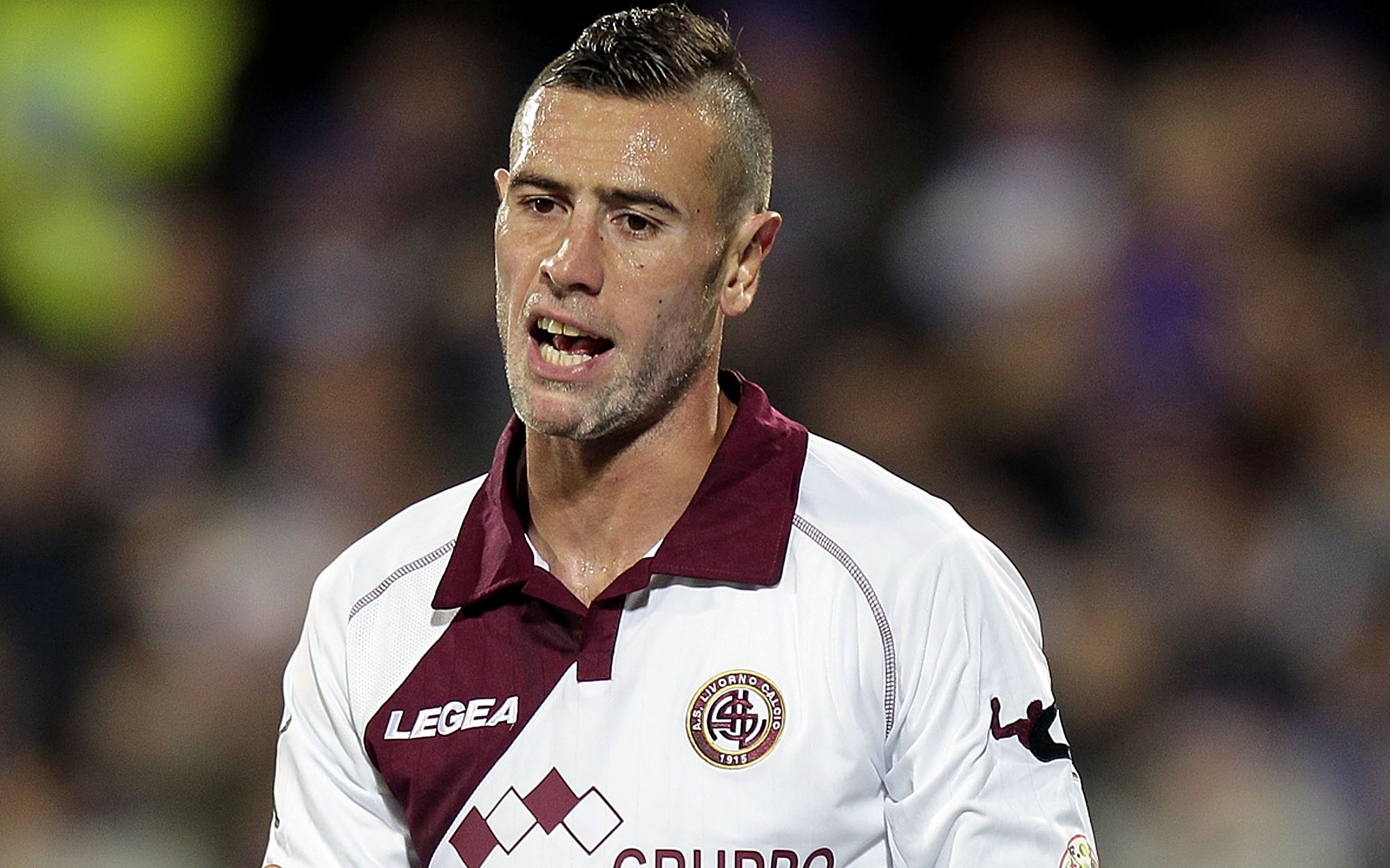 FLORENCE, ITALY - JANUARY 06: Leandro Rinaudo of AS Livorno Calcio reacts during the Serie A match between ACF Fiorentina and AS Livorno Calcio at Stadio Artemio Franchi on January 6, 2014 in Florence, Italy.  (Photo by Gabriele Maltinti/Getty Images)