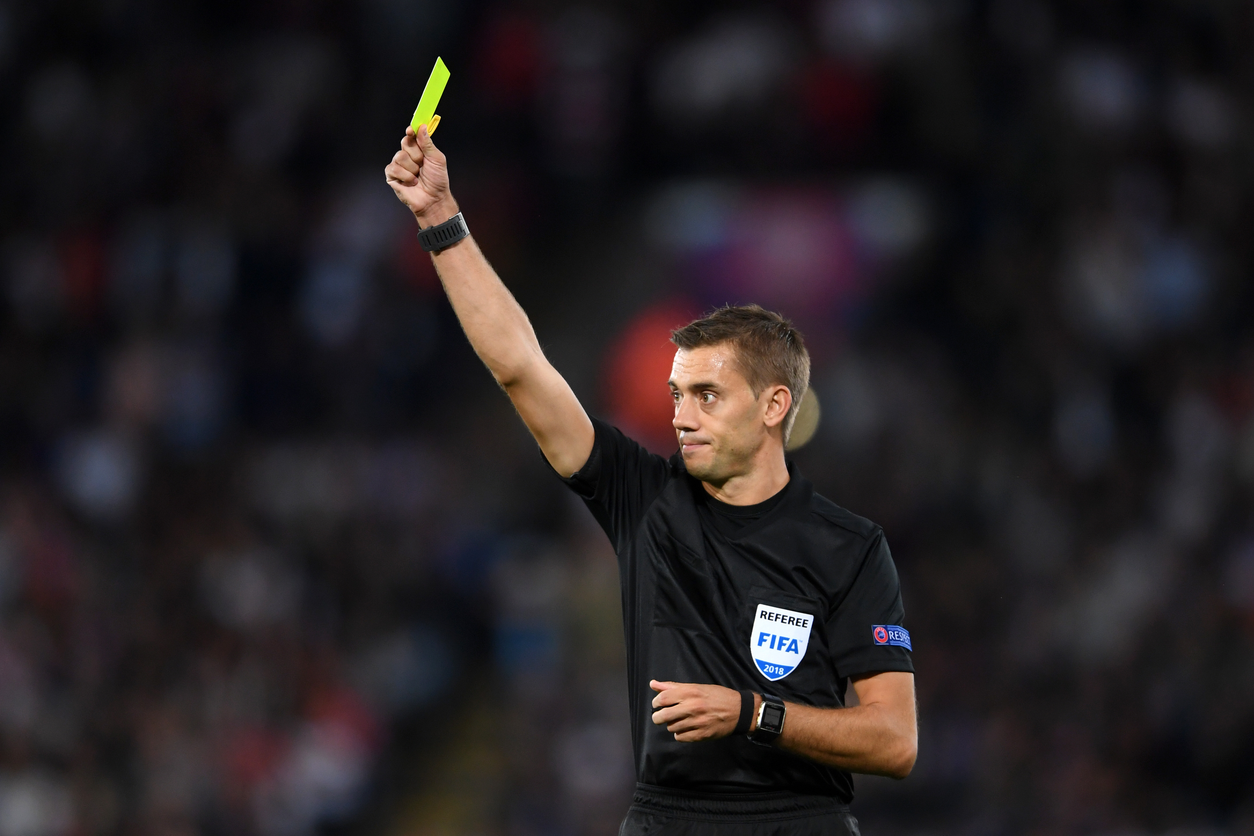 LEICESTER, ENGLAND - SEPTEMBER 11:  Referee Clément Turpin shows a yellow card during the international friendly match between England and Switzerland at The King Power Stadium on September 11, 2018 in Leicester, United Kingdom.  (Photo by Laurence Griffiths/Getty Images)