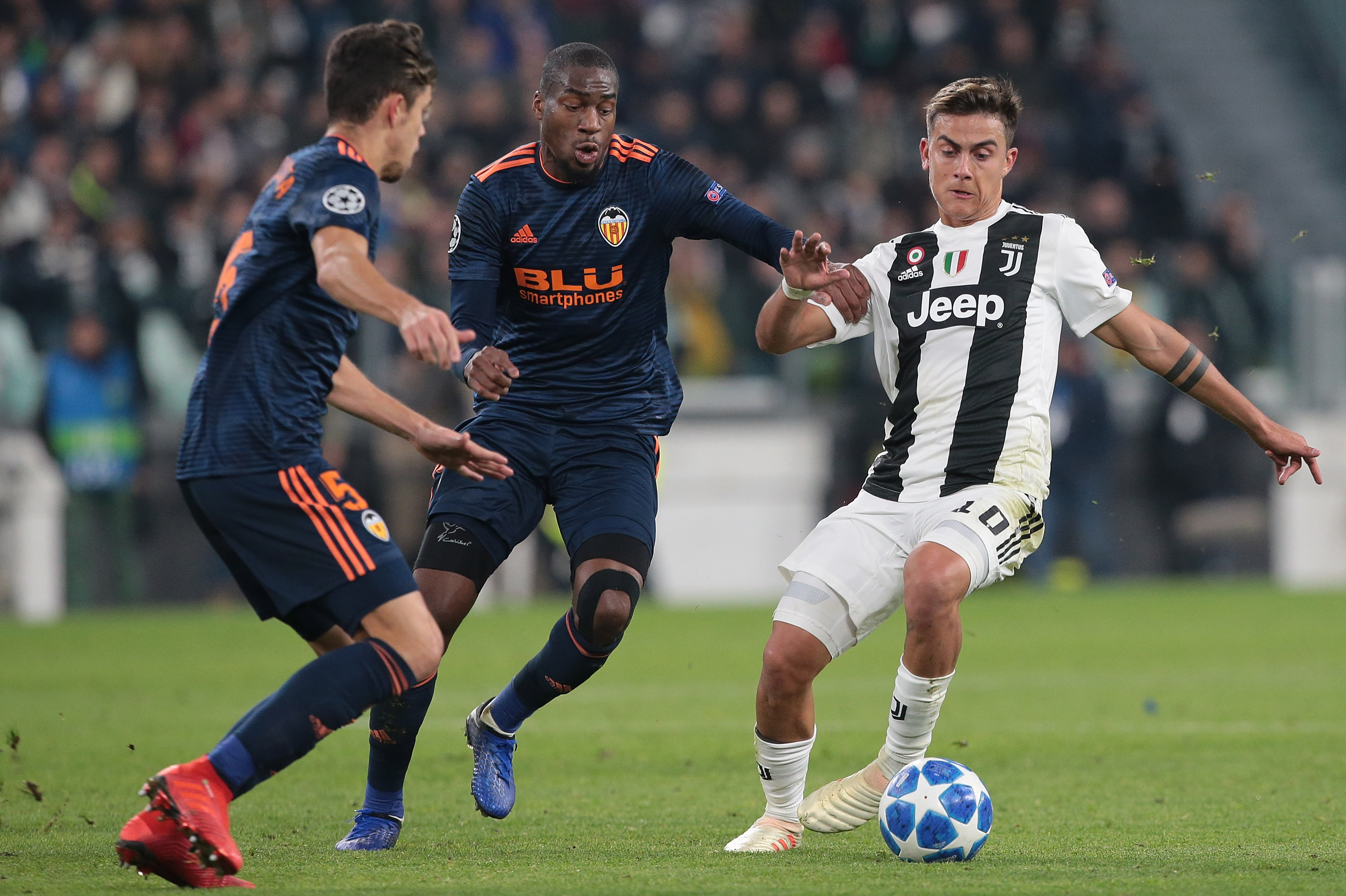 TURIN, ITALY - NOVEMBER 27:  Paulo Dybala of Juventus is challenged by Geoffrey Kondogbia of Valencia CF during the Group H match of the UEFA Champions League between Juventus and Valencia at Allianz Stadium on November 27, 2018 in Turin, Italy.  (Photo by Emilio Andreoli/Getty Images)