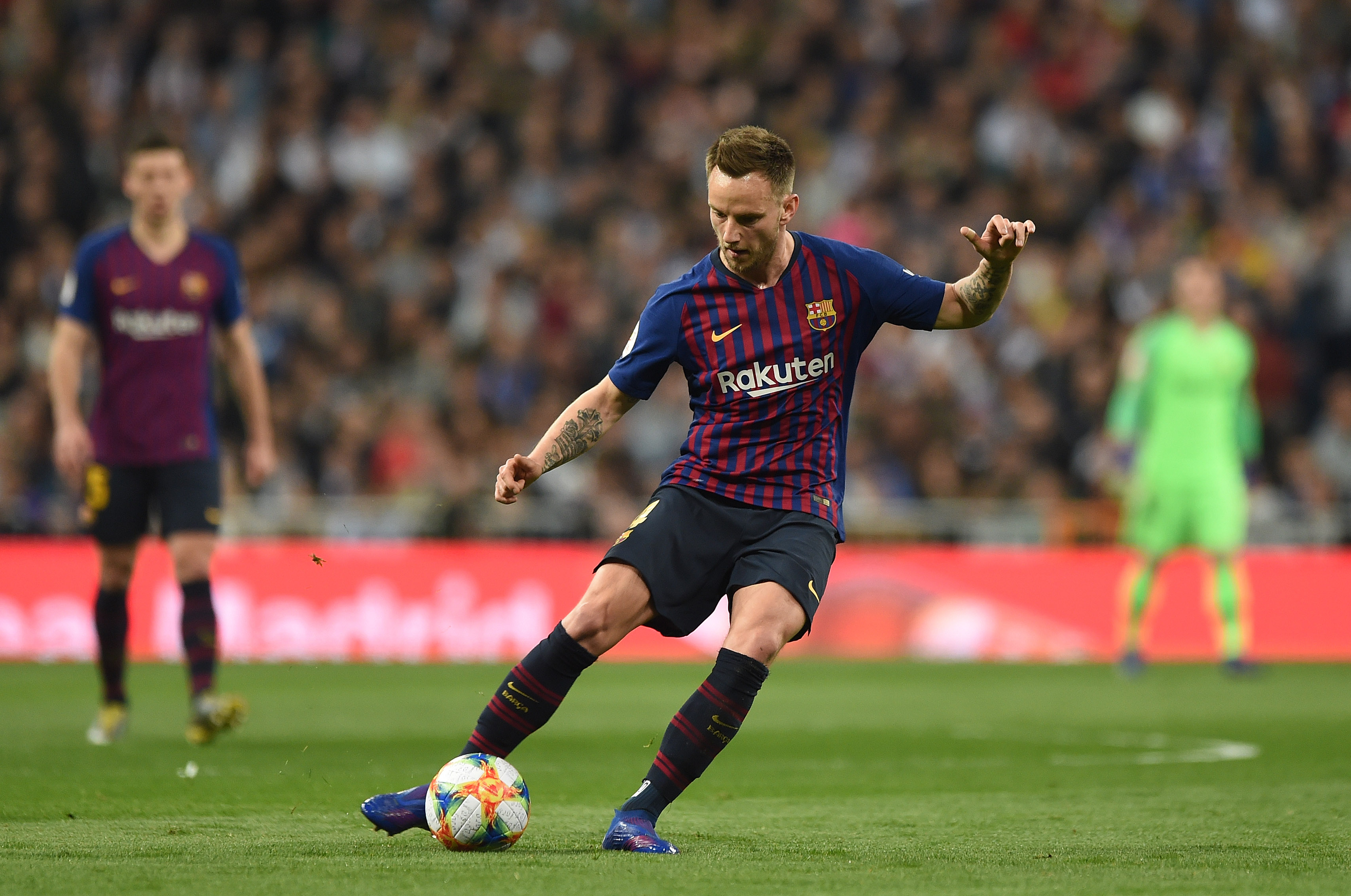 MADRID, SPAIN - FEBRUARY 27: Ivan Rakitic of FC Barcelona passes the ball during the Copa del Semi Final match second leg between Real Madrid and Barcelona at Bernabeu on February 27, 2019 in Madrid, Spain. (Photo by Denis Doyle/Getty Images)