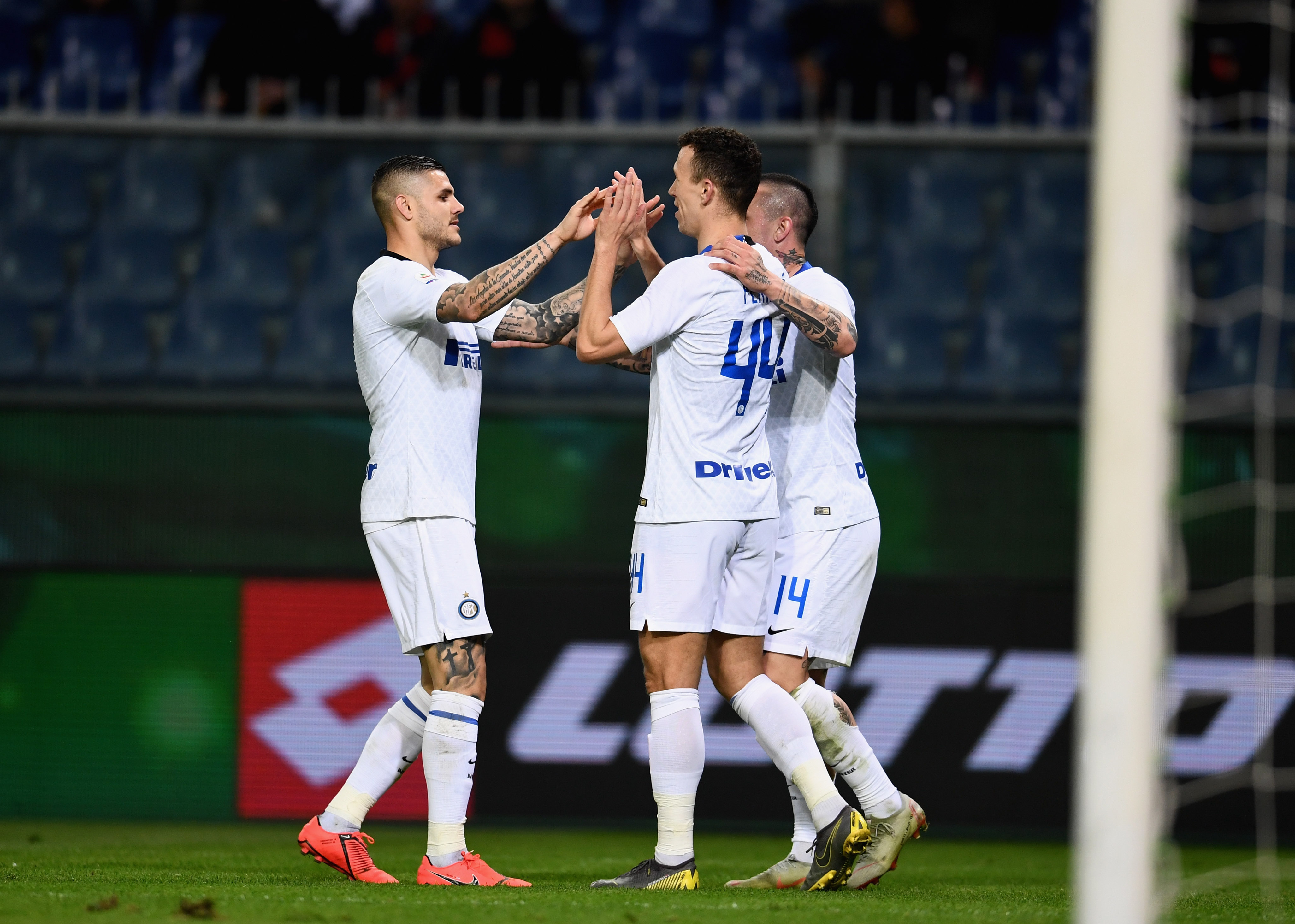 GENOA, ITALY - APRIL 03:  Ivan Perisic of FC Internazionale #44 celebrates with Mauro Icardi after scoring the third goal during the Serie A match between Genoa CFC and FC Internazionale at Stadio Luigi Ferraris on April 3, 2019 in Genoa, Italy.  (Photo by Claudio Villa - Inter/Inter via Getty Images)