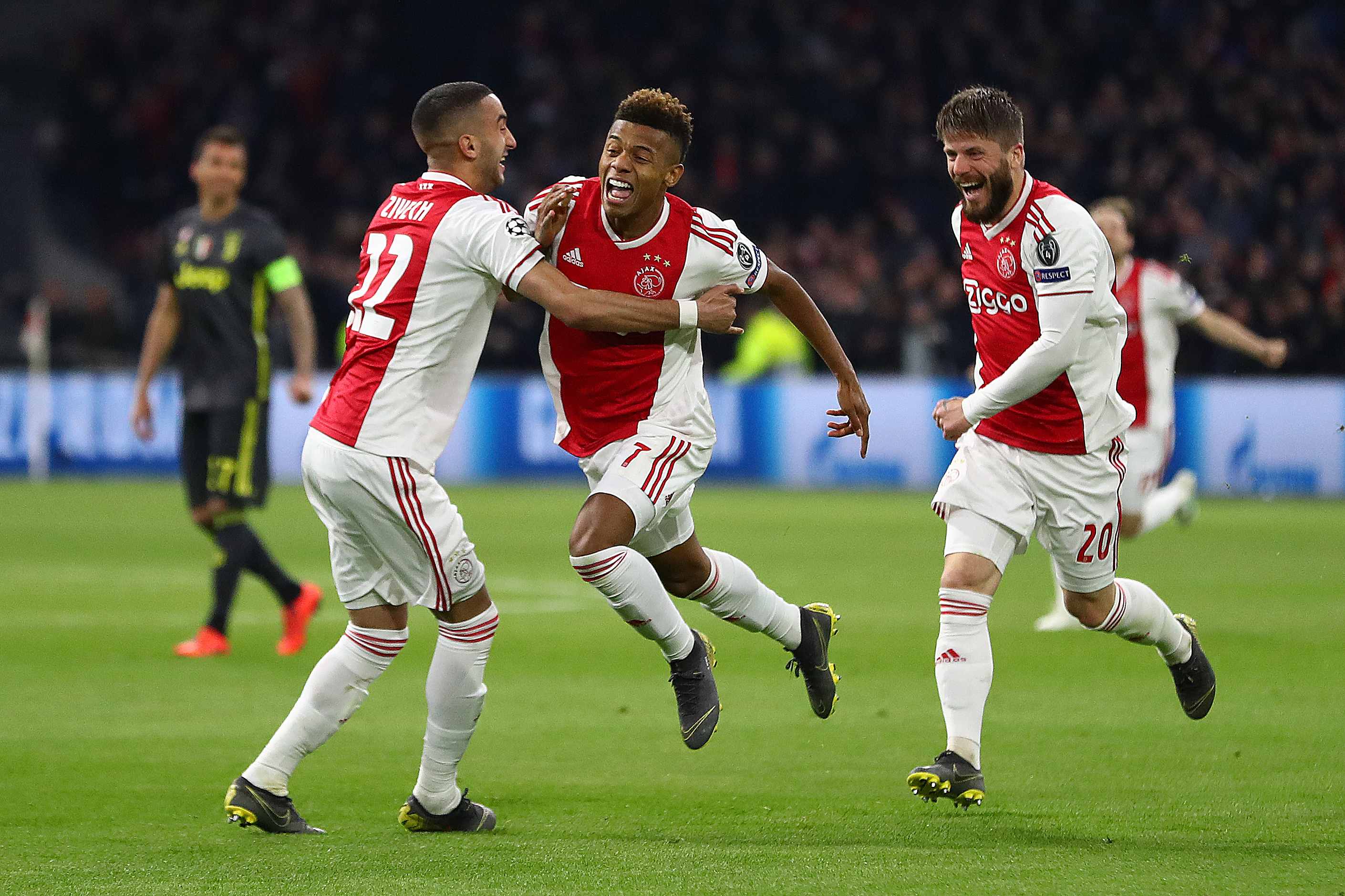 AMSTERDAM, NETHERLANDS - APRIL 10:  David Neres of Ajax celebrates scoring the equalising goal alongside Hakim Ziyech (L) and Lasse Schone (R) during the UEFA Champions League Quarter Final first leg match between Ajax and Juventus at Johan Cruyff Arena on April 10, 2019 in Amsterdam, Netherlands. (Photo by Michael Steele/Getty Images)
