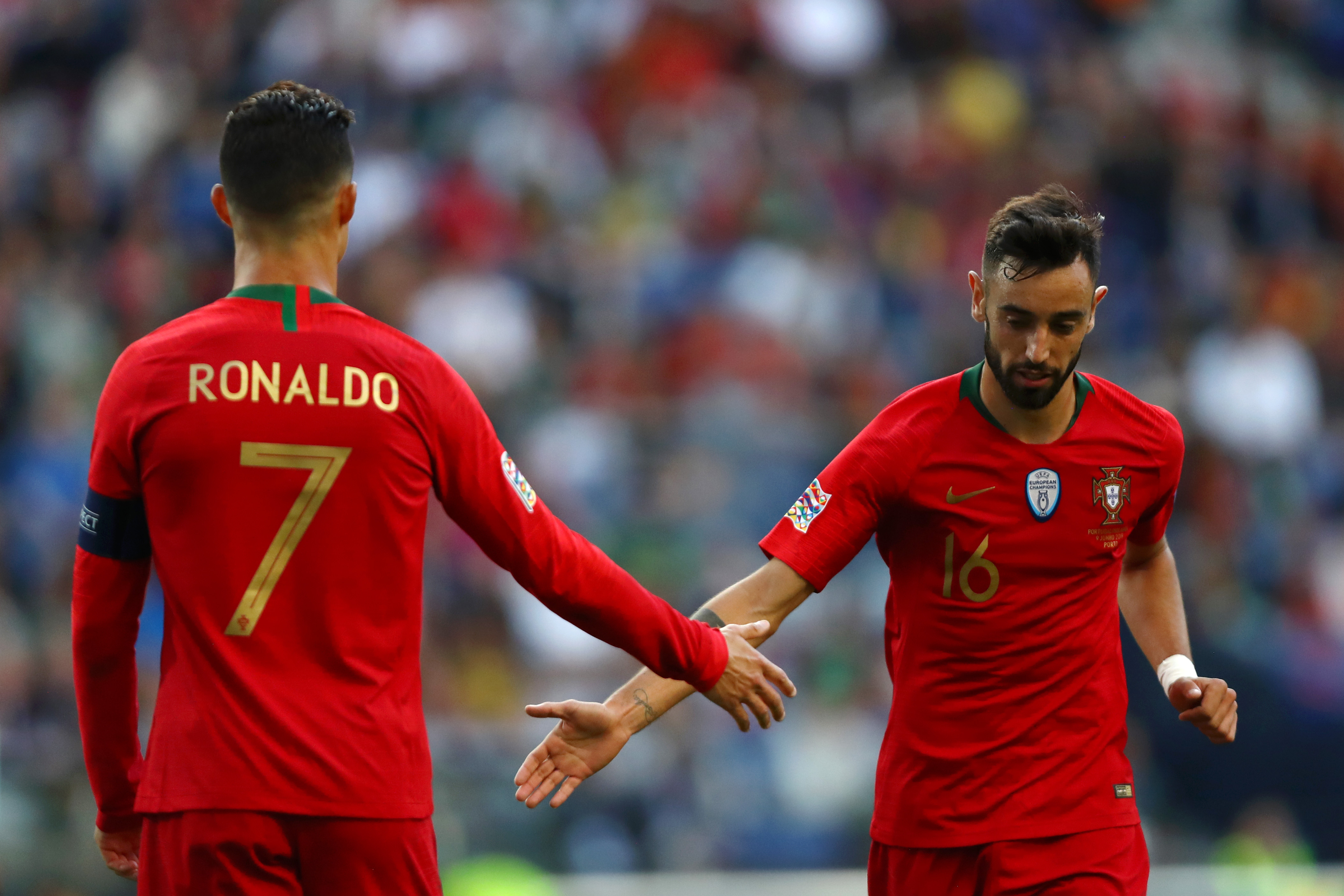 PORTO, PORTUGAL - JUNE 09: Cristiano Ronaldo of Portugal speaks with Bruno Fernandes of Portugal during the UEFA Nations League Final between Portugal and the Netherlands at Estadio do Dragao on June 09, 2019 in Porto, Portugal. (Photo by Dean Mouhtaropoulos/Getty Images)